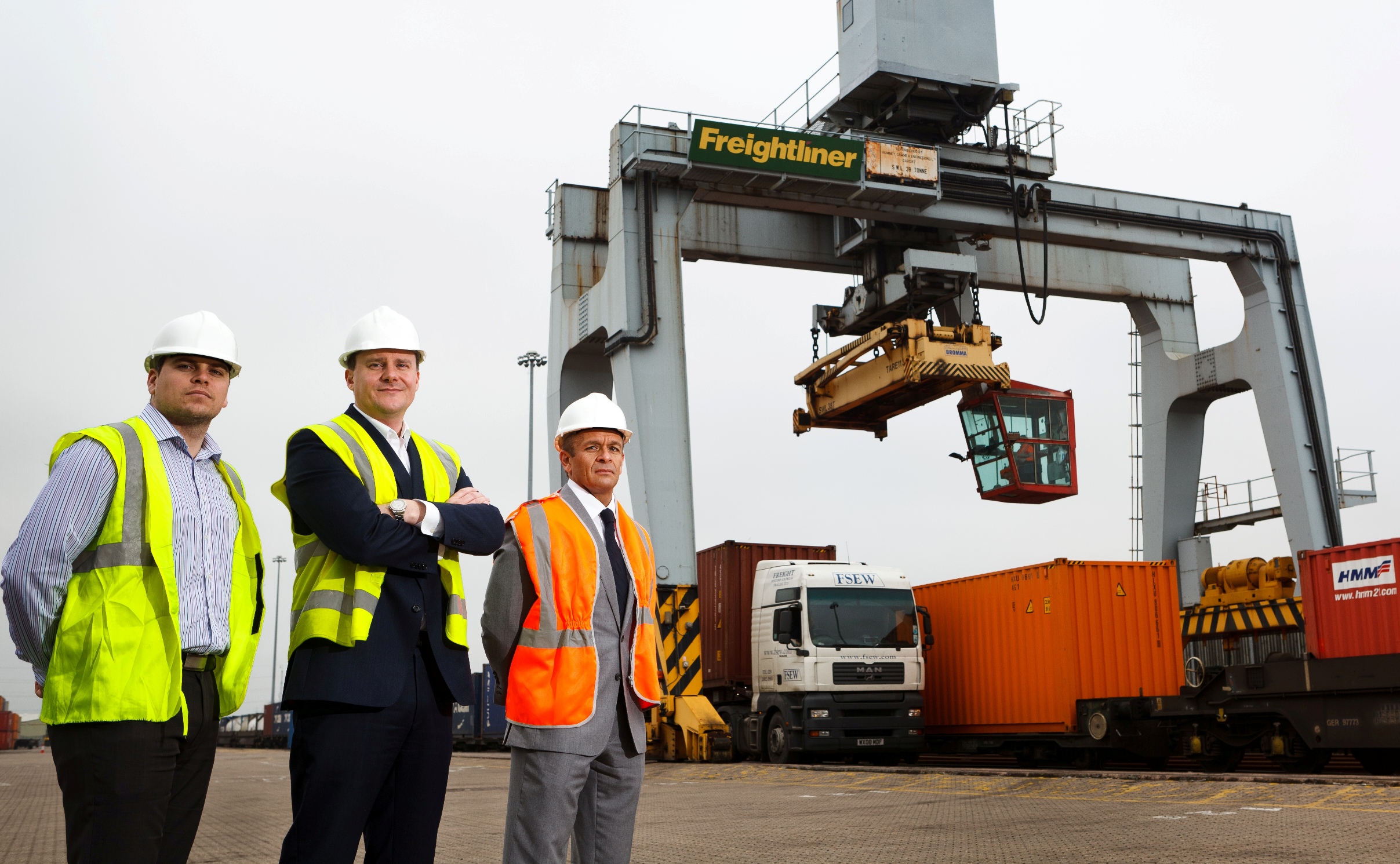 Gethin Worgan, Geoff Tomlinson and Mark Leveridge stand in front of container lift